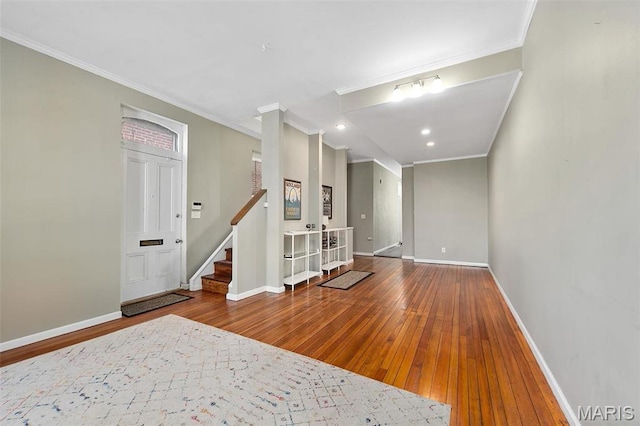 2610 Rutger St, Saint Louis, MO 63104 - spare room featuring wood-type flooring, crown molding, recessed lighting, and stairs
