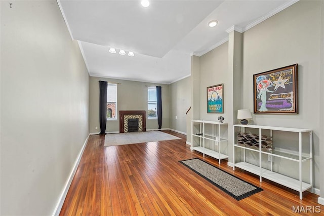 2610 Rutger St, Saint Louis, MO 63104 - living area featuring ornamental molding, hardwood / wood-style floors, a fireplace, and recessed lighting