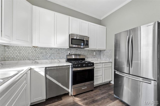 2610 Rutger St, Saint Louis, MO 63104 - kitchen with stainless steel appliances, crown molding, white cabinets, light stone counters, and decorative backsplash
