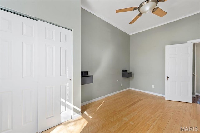 2610 Rutger St, Saint Louis, MO 63104 - unfurnished bedroom with crown molding, light wood-style floors, a closet, and a ceiling fan