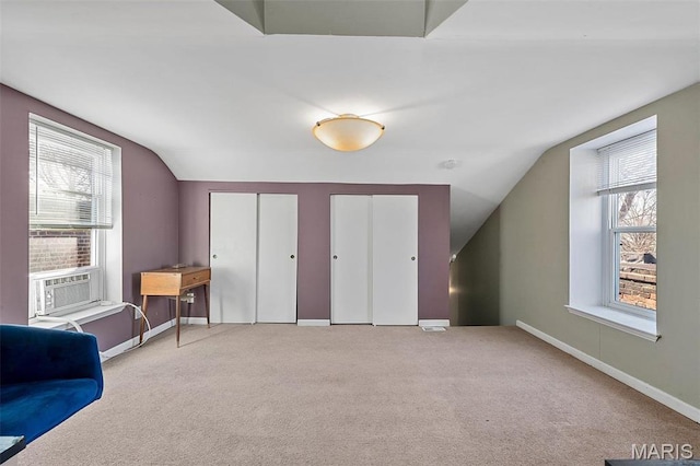 2610 Rutger St, Saint Louis, MO 63104 - additional living space with lofted ceiling, carpet flooring, and cooling unit