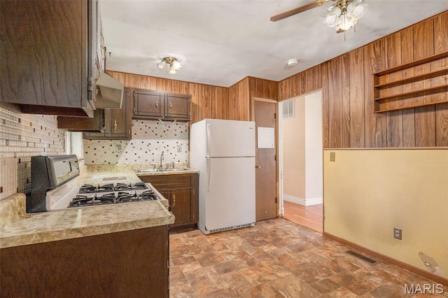 1483 Noche Ct, Fenton, MO 63026 - kitchen featuring white appliances, stone finish floors, light countertops, backsplash, and a ceiling fan