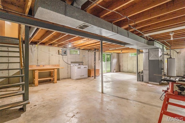 1483 Noche Ct, Fenton, MO 63026 - below grade area with water heater, washing machine and dryer, healthy amount of natural light, and heating unit