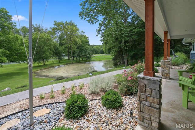 727 Madison Vly, Wildwood, MO 63005 - view of patio featuring a water view