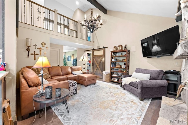 727 Madison Vly, Wildwood, MO 63005 - living room with wood finished floors, a barn door, beamed ceiling, a chandelier, and high vaulted ceiling