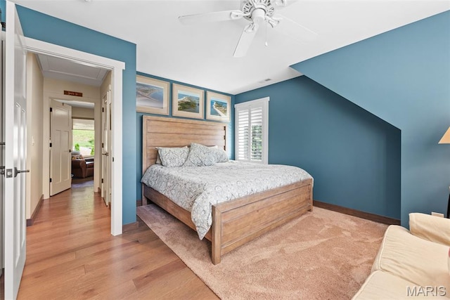 727 Madison Vly, Wildwood, MO 63005 - bedroom with wood finished floors, multiple windows, a ceiling fan, and attic access