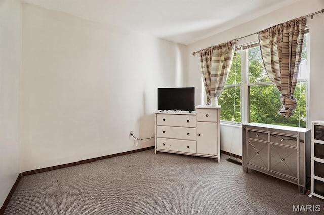 3722 Candlewyck Club Dr D, Unit D, MO 63034 - living area featuring baseboards and carpet flooring