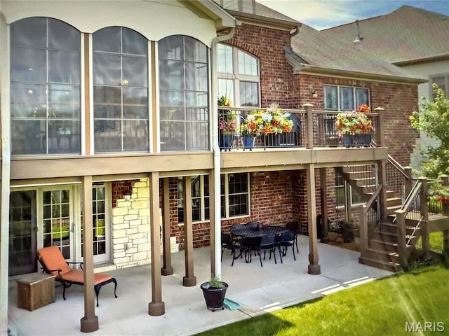 259 Meadowbrook Country Club Est, Ballwin, MO 63011 - back of property with brick siding, a patio, stairway, and a shingled roof