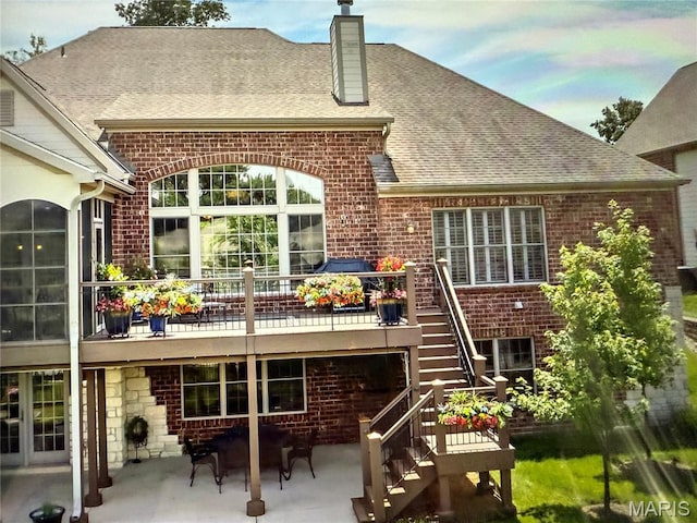 259 Meadowbrook Country Club Est, Ballwin, MO 63011 - rear view of house with brick siding, a patio area, stairway, a chimney, and a shingled roof