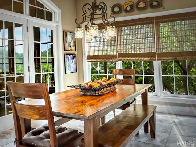 259 Meadowbrook Country Club Est, Ballwin, MO 63011 - dining area with tile patterned floors and a chandelier