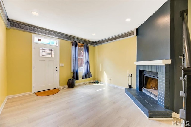 3452 Texas Ave, Saint Louis, MO 63118 - unfurnished living room featuring wood finished floors, a fireplace, recessed lighting, and ornamental molding