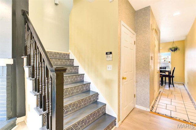 3452 Texas Ave, Saint Louis, MO 63118 - stairway featuring wood finished floors and baseboards