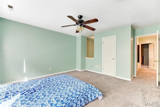 3452 Texas Ave, Saint Louis, MO 63118 - unfurnished bedroom featuring carpet flooring and a ceiling fan