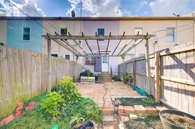 3452 Texas Ave, Saint Louis, MO 63118 - back of property featuring a pergola, a fenced backyard, and a patio area