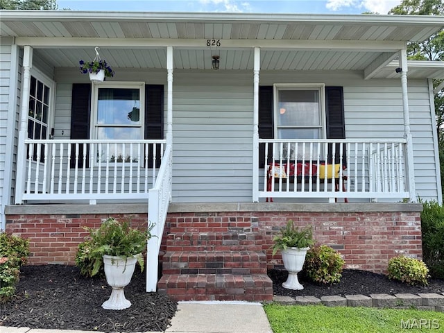 826 Birdie Ln, Jackson, MO 63755 - doorway to property featuring covered porch
