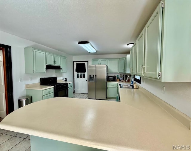 826 Birdie Ln, Jackson, MO 63755 - kitchen with black appliances, under cabinet range hood, a peninsula, and light tile patterned floors