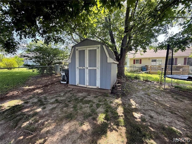 826 Birdie Ln, Jackson, MO 63755 - view of shed featuring a trampoline and a fenced backyard