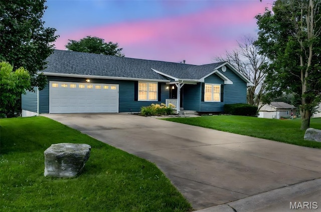 148 Castlewood Dr, Troy, MO 63379 - ranch-style house featuring driveway, a garage, a yard, and roof with shingles