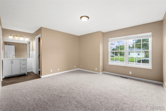 148 Castlewood Dr, Troy, MO 63379 - unfurnished bedroom featuring dark colored carpet and baseboards