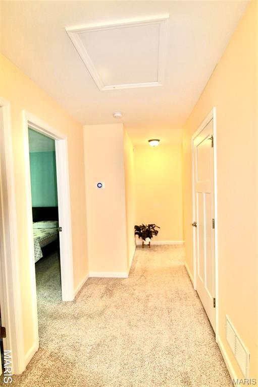 1001 Windsor Crest Ct, Cottleville, MO 63376 - corridor with carpet floors and attic access