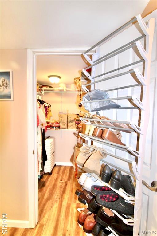 1001 Windsor Crest Ct, Cottleville, MO 63376 - spacious closet with wood finished floors
