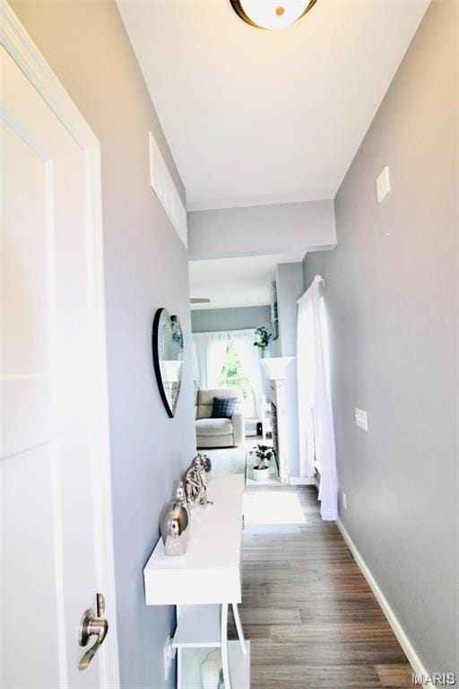 1001 Windsor Crest Ct, Cottleville, MO 63376 - hallway featuring wood finished floors and baseboards