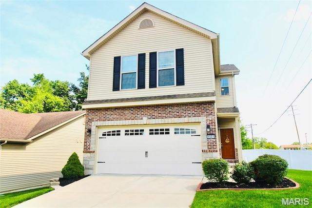1001 Windsor Crest Ct, Cottleville, MO 63376 - traditional-style home featuring concrete driveway, an attached garage, and brick siding