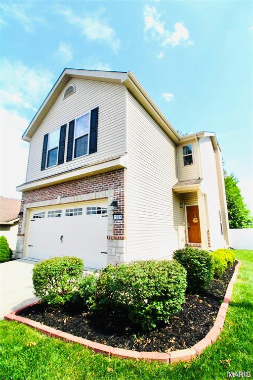 1001 Windsor Crest Ct, Cottleville, MO 63376 - view of front of house with a garage and driveway