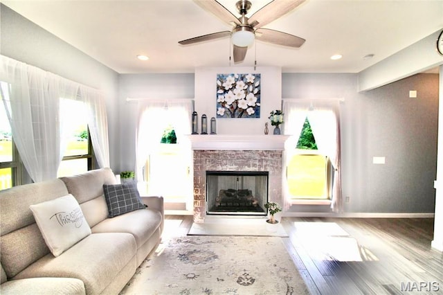 1001 Windsor Crest Ct, Cottleville, MO 63376 - living room with wood finished floors, a ceiling fan, a fireplace with flush hearth, and recessed lighting