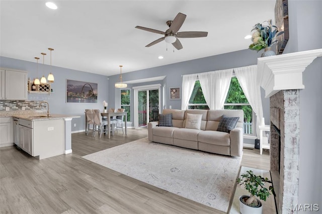 1001 Windsor Crest Ct, Cottleville, MO 63376 - living area with a ceiling fan, light wood-style floors, recessed lighting, and a fireplace
