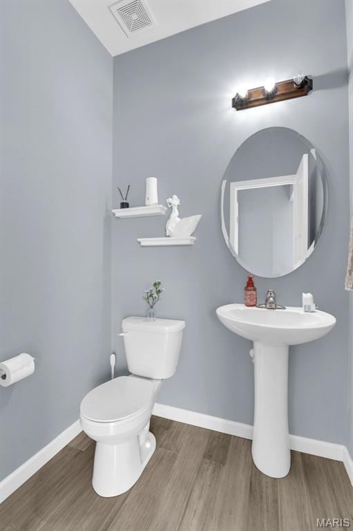 1001 Windsor Crest Ct, Cottleville, MO 63376 - half bath featuring wood finished floors and toilet