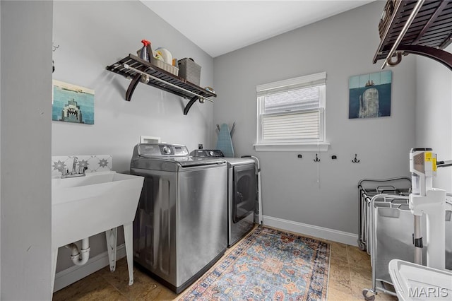 105 Cypress Meadows Dr, Wentzville, MO 63385 - laundry area with washing machine and clothes dryer and baseboards