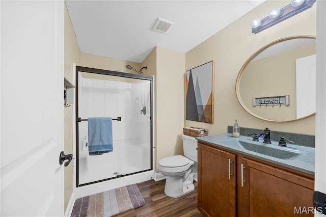 105 Cypress Meadows Dr, Wentzville, MO 63385 - bathroom featuring a shower stall, wood finished floors, and vanity