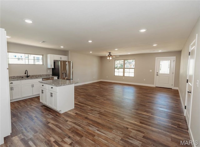 501 W 2nd, Dixon, MO 65459 - kitchen featuring stainless steel fridge with ice dispenser, a ceiling fan, recessed lighting, white cabinetry, and a center island