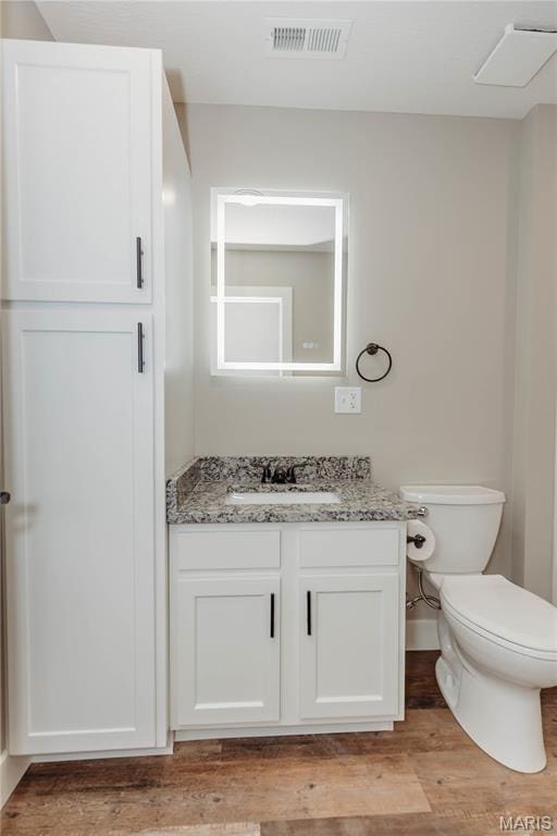 501 W 2nd, Dixon, MO 65459 - half bath featuring vanity and wood finished floors
