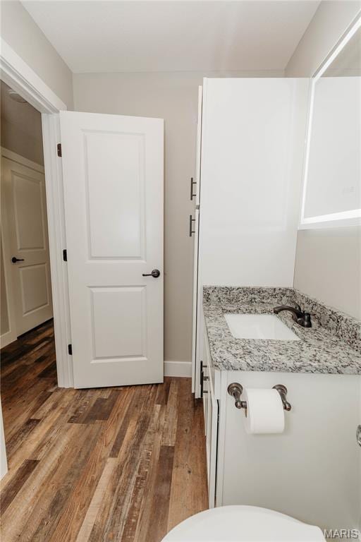 501 W 2nd, Dixon, MO 65459 - bathroom with vanity and wood finished floors