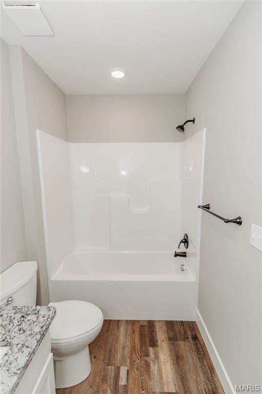 501 W 2nd, Dixon, MO 65459 - full bathroom with vanity, wood finished floors,  shower combination, and recessed lighting