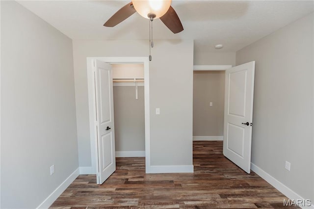 501 W 2nd, Dixon, MO 65459 - unfurnished bedroom featuring wood finished floors, a closet, and ceiling fan