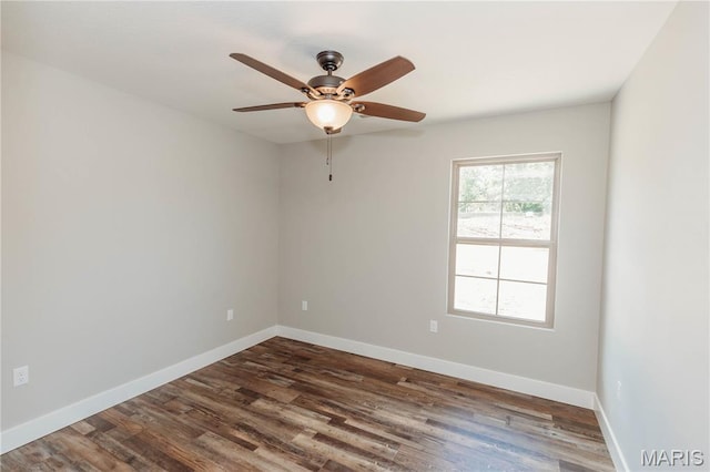 501 W 2nd, Dixon, MO 65459 - empty room featuring ceiling fan and dark wood-type flooring