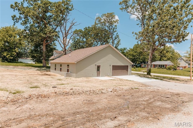 501 W 2nd, Dixon, MO 65459 - garage featuring concrete driveway