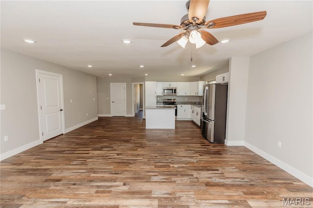 501 W 2nd, Dixon, MO 65459 - kitchen featuring appliances with stainless steel finishes, open floor plan, recessed lighting, a ceiling fan, and white cabinetry