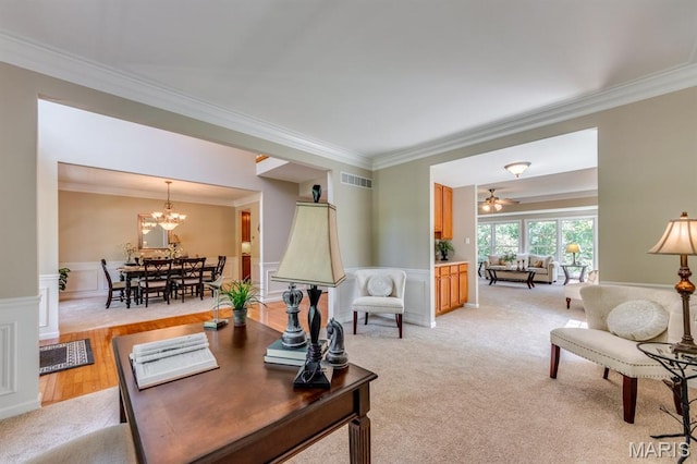 1515 Dietrich Glen Dr, Ballwin, MO 63021 - living room featuring ornamental molding, a chandelier, light colored carpet, and wainscoting