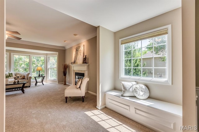 1515 Dietrich Glen Dr, Ballwin, MO 63021 - sitting room with healthy amount of natural light, crown molding, light colored carpet, a tile fireplace, and a ceiling fan