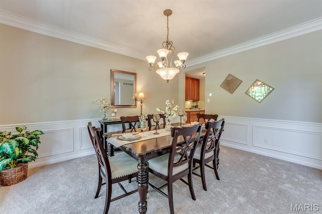 1515 Dietrich Glen Dr, Ballwin, MO 63021 - dining space featuring light carpet, crown molding, a chandelier, wainscoting, and a decorative wall