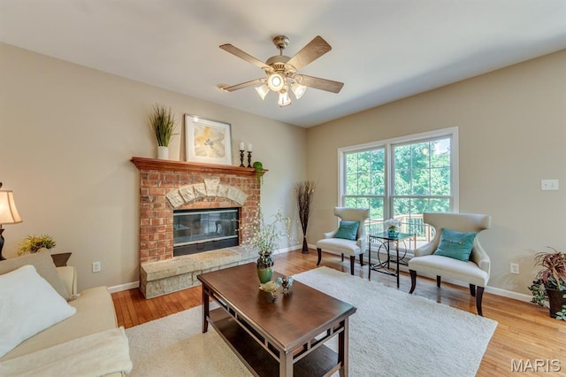 1515 Dietrich Glen Dr, Ballwin, MO 63021 - living room with a ceiling fan, wood finished floors, and a fireplace