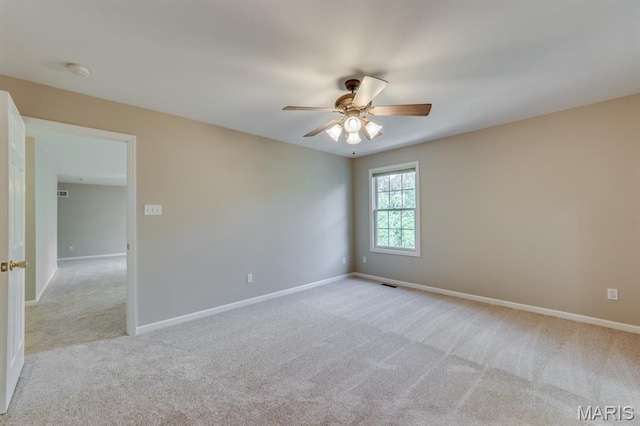 1515 Dietrich Glen Dr, Ballwin, MO 63021 - unfurnished room featuring light carpet, a ceiling fan, and a smoke detector