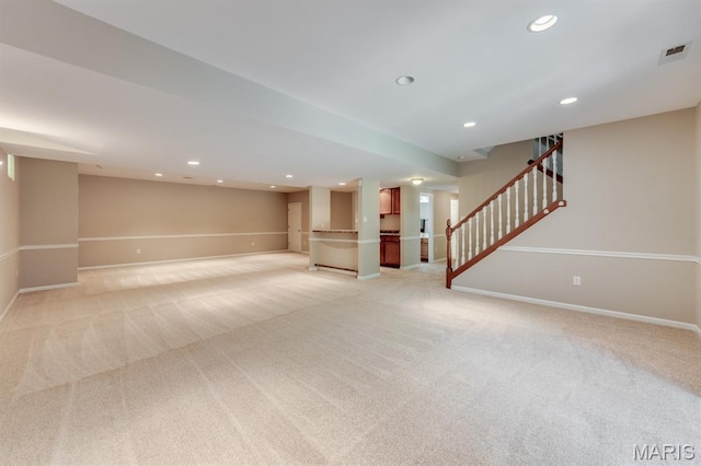 1515 Dietrich Glen Dr, Ballwin, MO 63021 - finished basement featuring light colored carpet, stairway, and recessed lighting