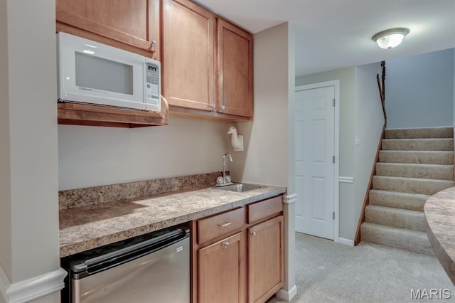 1515 Dietrich Glen Dr, Ballwin, MO 63021 - kitchen with white microwave, dishwashing machine, light countertops, and light colored carpet