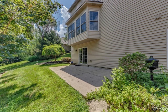 1515 Dietrich Glen Dr, Ballwin, MO 63021 - rear view of house with a lawn and a patio area