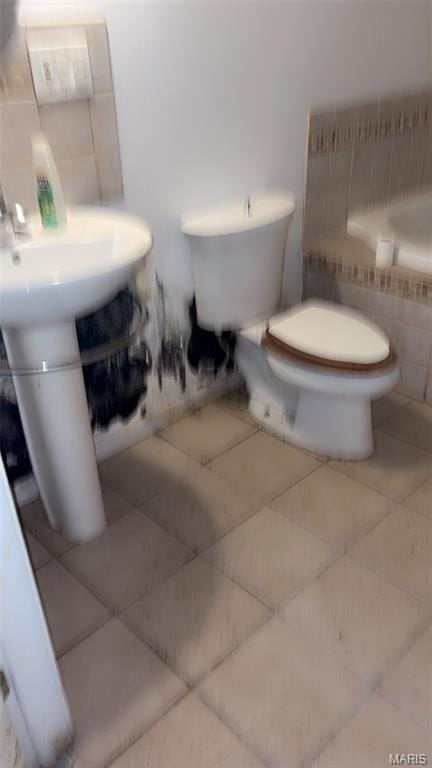 1178 Riverview Blvd, Saint Louis, MO 63147 - bathroom featuring toilet and tile patterned flooring